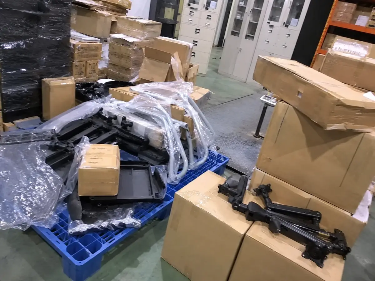 Plastic auto parts packed and staged for consolidated shipment from China